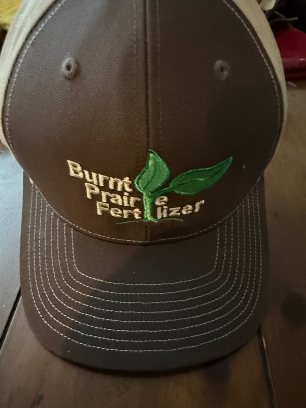 Burnt Prairie Fertilizer Embroidered Brown Trucker Hat